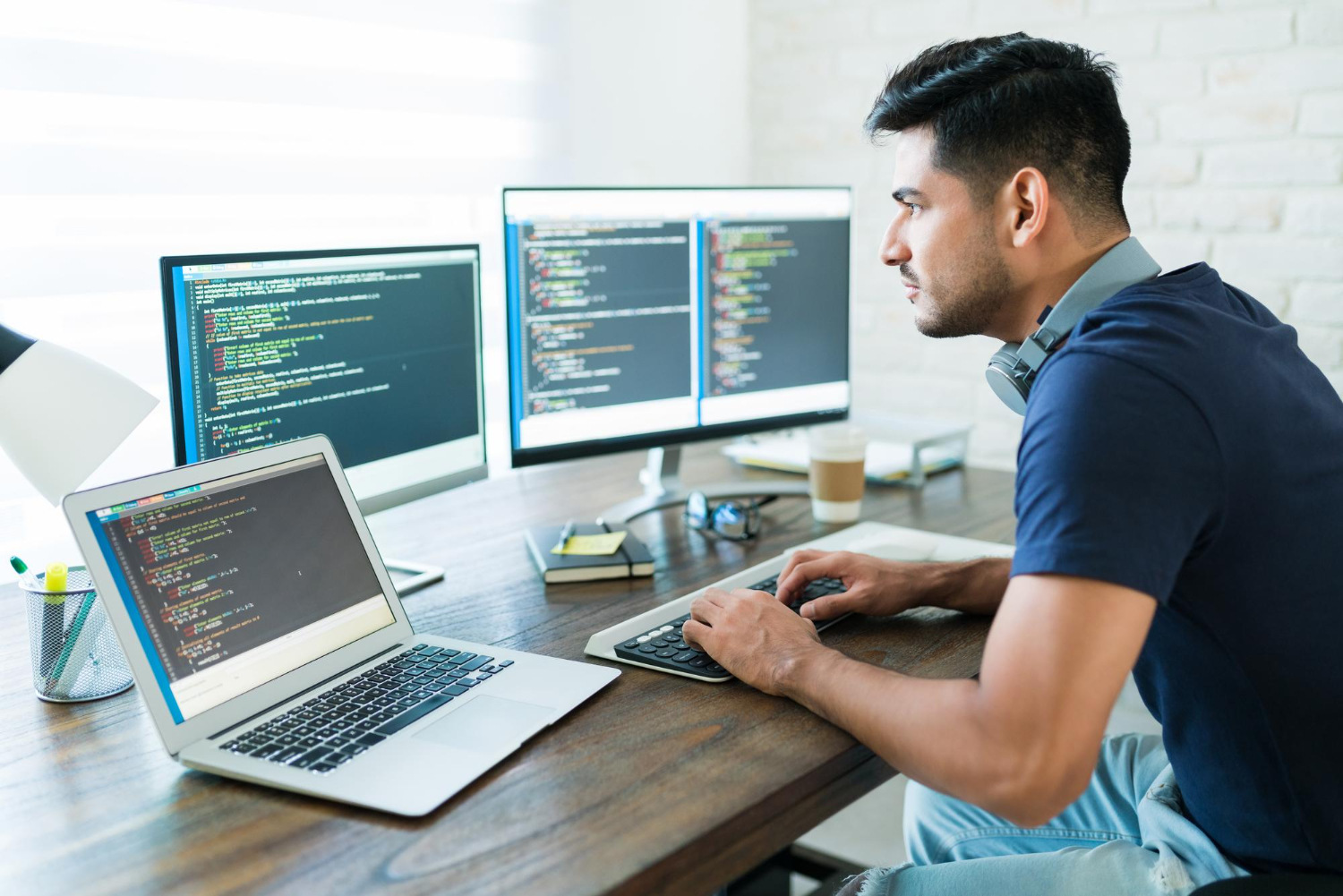 software developer writing code in software development company